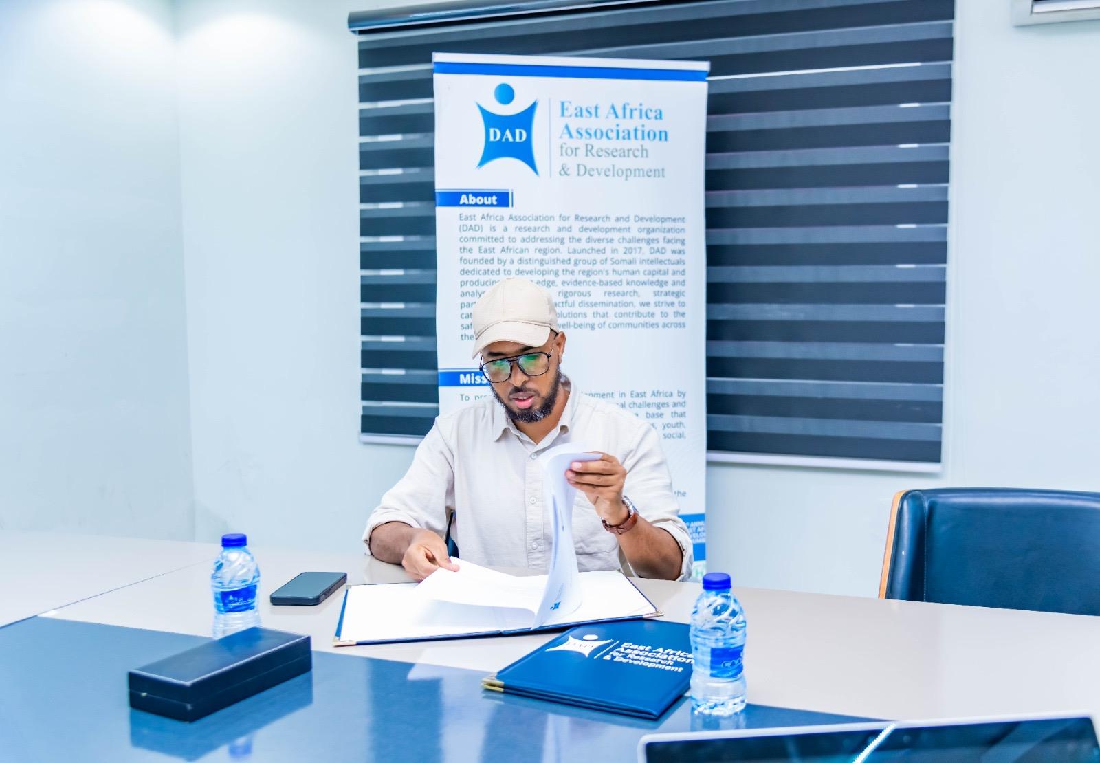 Anas Ali Dahir presenting at a research forum